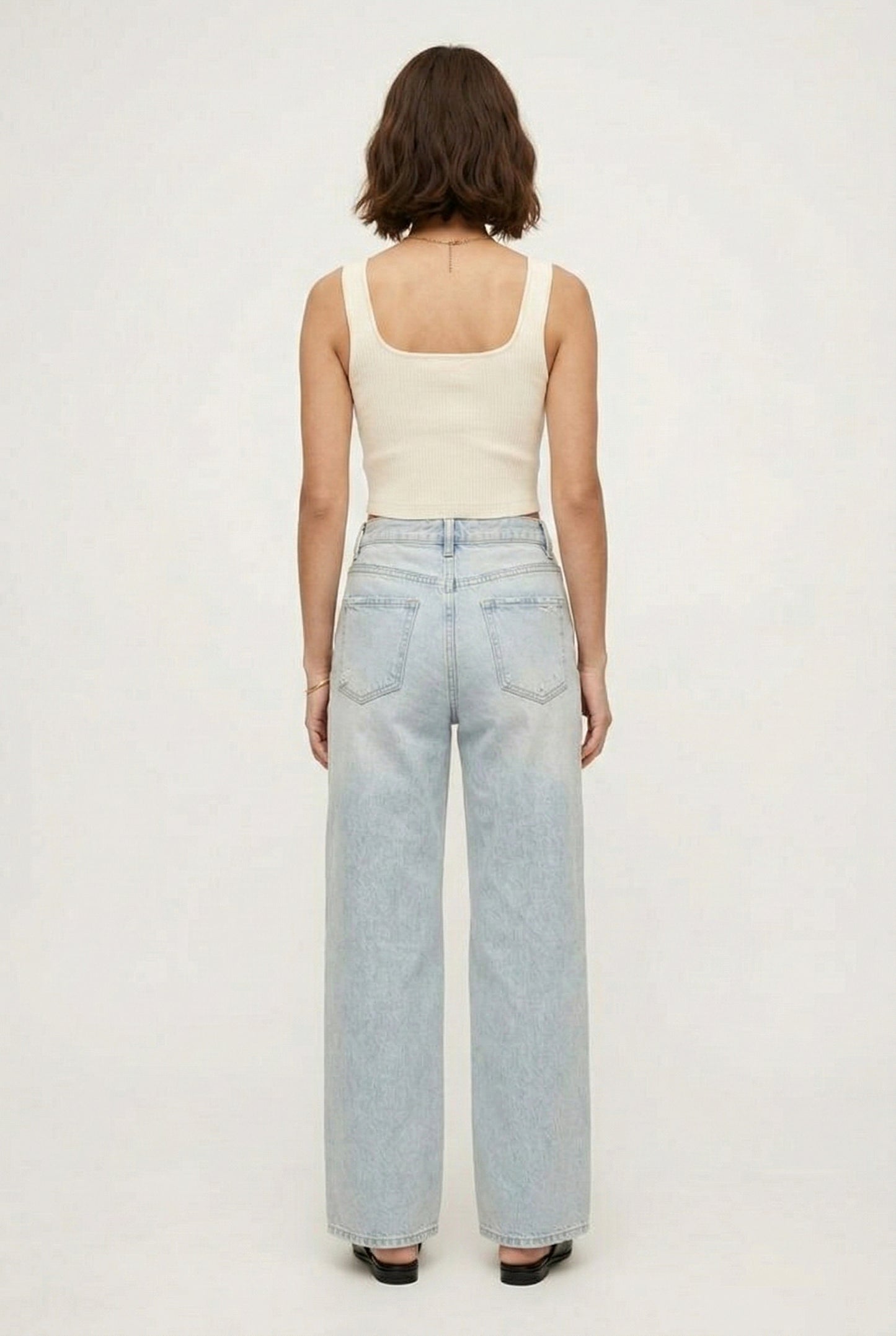 LOHNR Rowe Relaxed Jean. A structured, mid-to-high rise straight-leg denim pant featuring subtle distressed detailing and a classic five-pocket design.