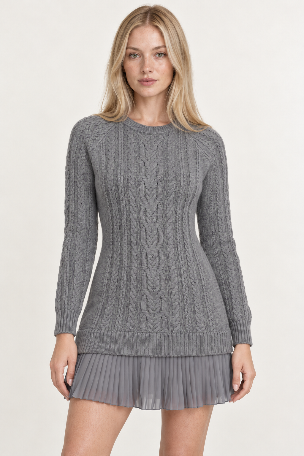 Woman wearing a cable-knit mini dress with a pleated hem in Stone Grey, front view #807E80