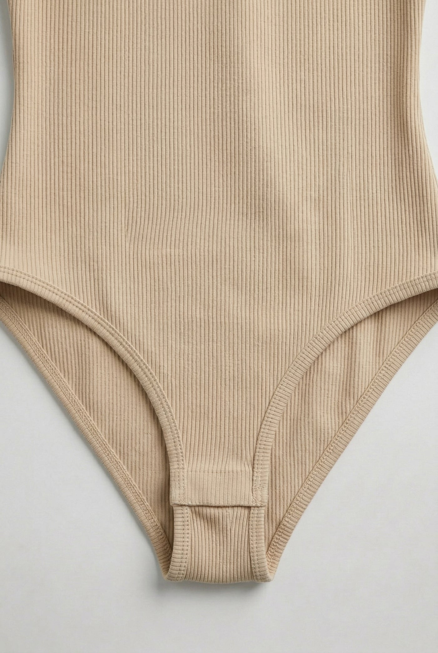 Model wearing an Almond beige square neck one-piece swimsuit