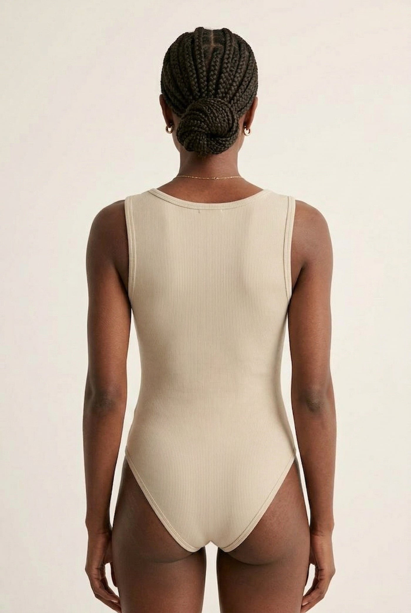 Model wearing an Almond beige square neck one-piece swimsuit