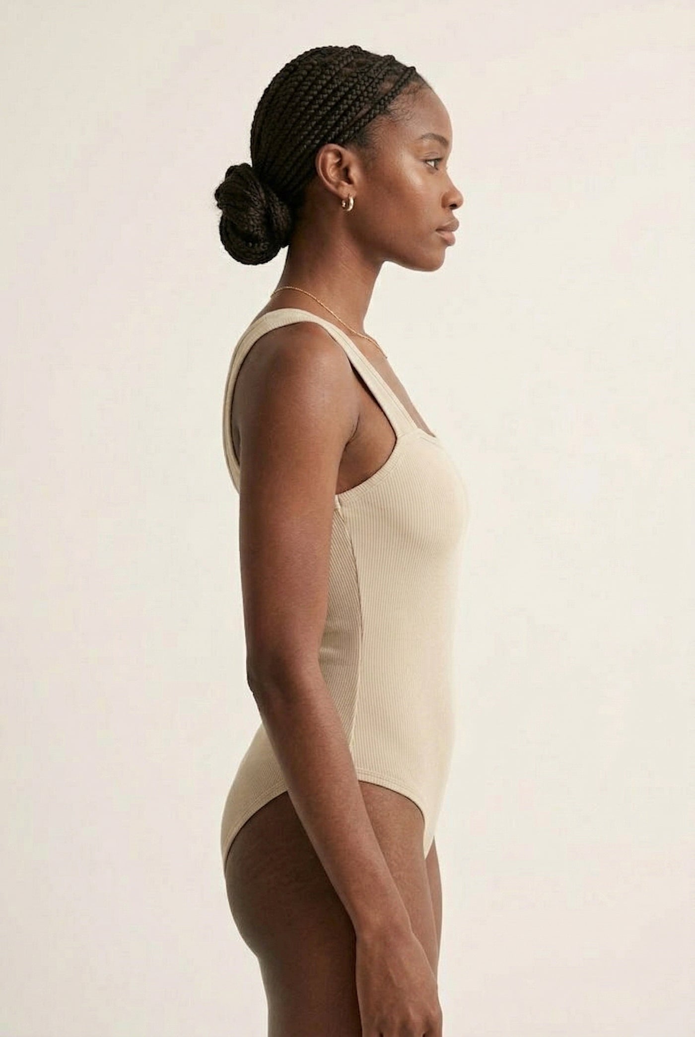 Model wearing an Almond beige square neck one-piece swimsuit