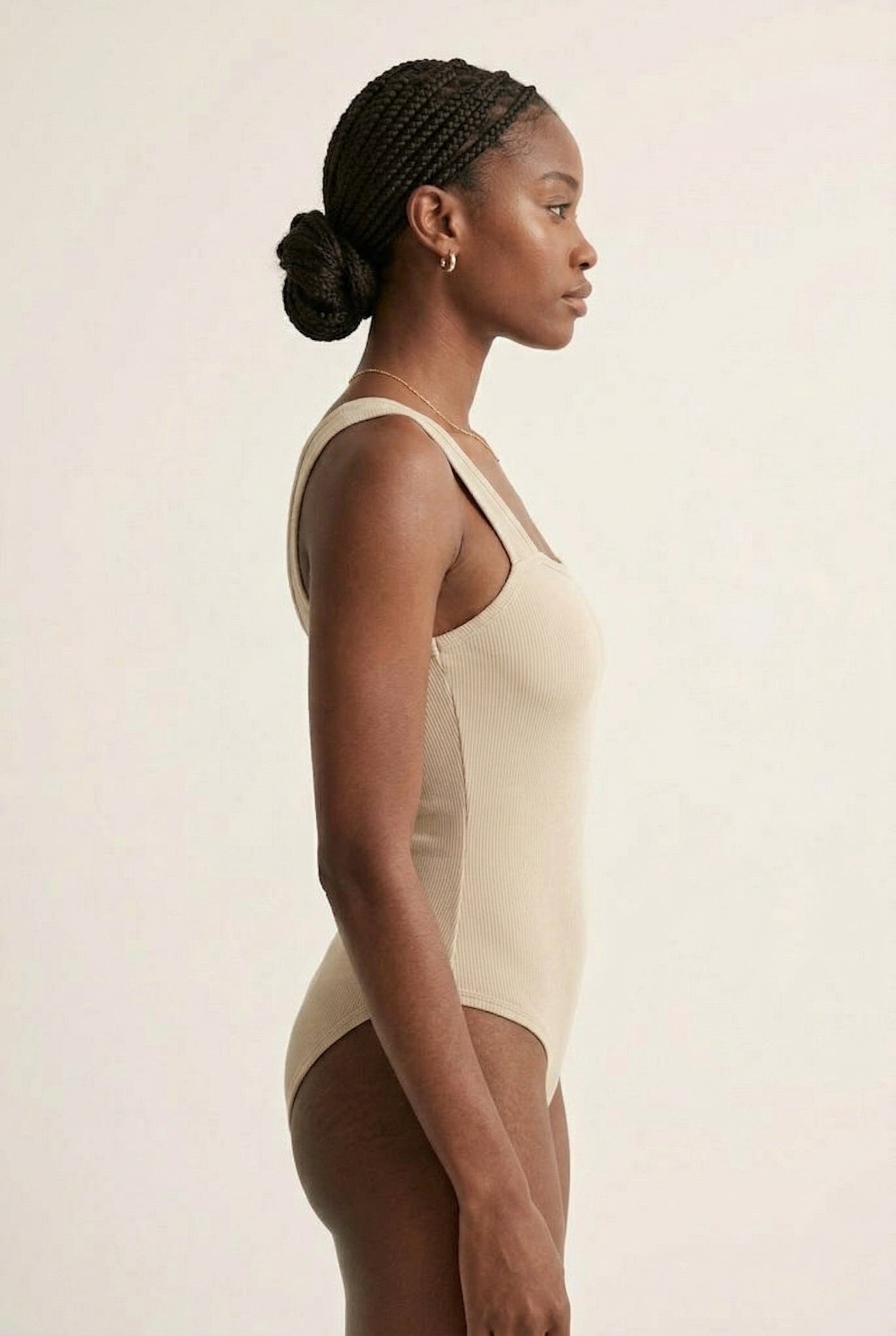 Model wearing an Almond beige square neck one-piece swimsuit