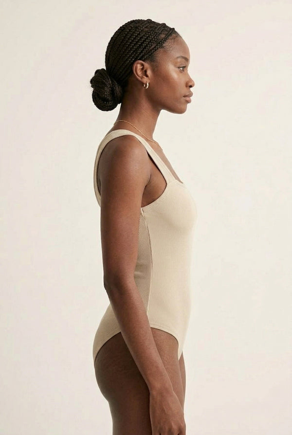 Model wearing an Almond beige square neck one-piece swimsuit