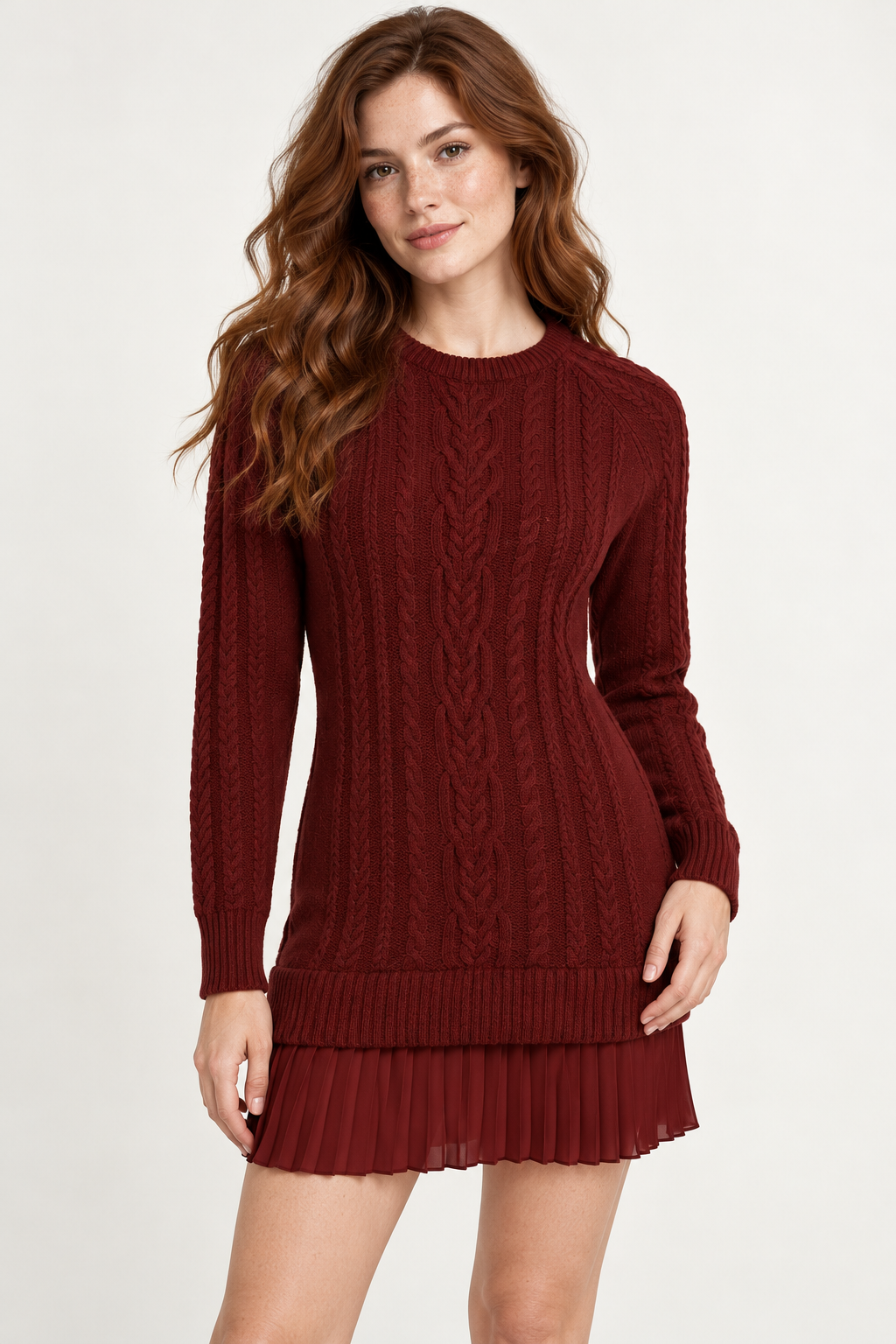 Woman wearing a cable-knit mini dress with a pleated hem in Mulled Wine, front view #561312