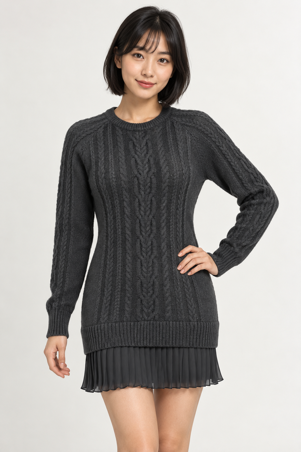 Woman wearing a cable-knit mini dress with a pleated hem in Carbon Grey, front view #373738