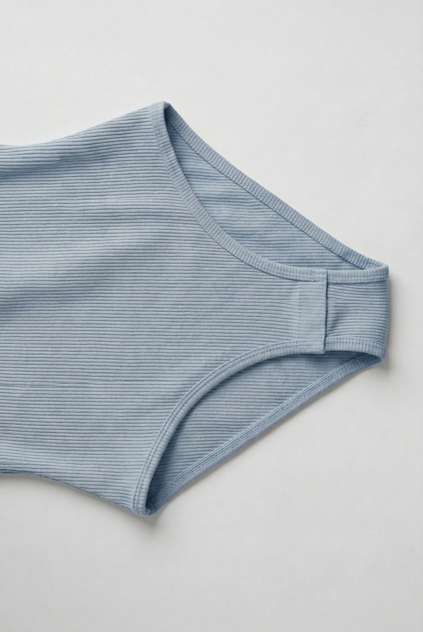Model wearing an Echo Blue light blue square neck one-piece swimsuit