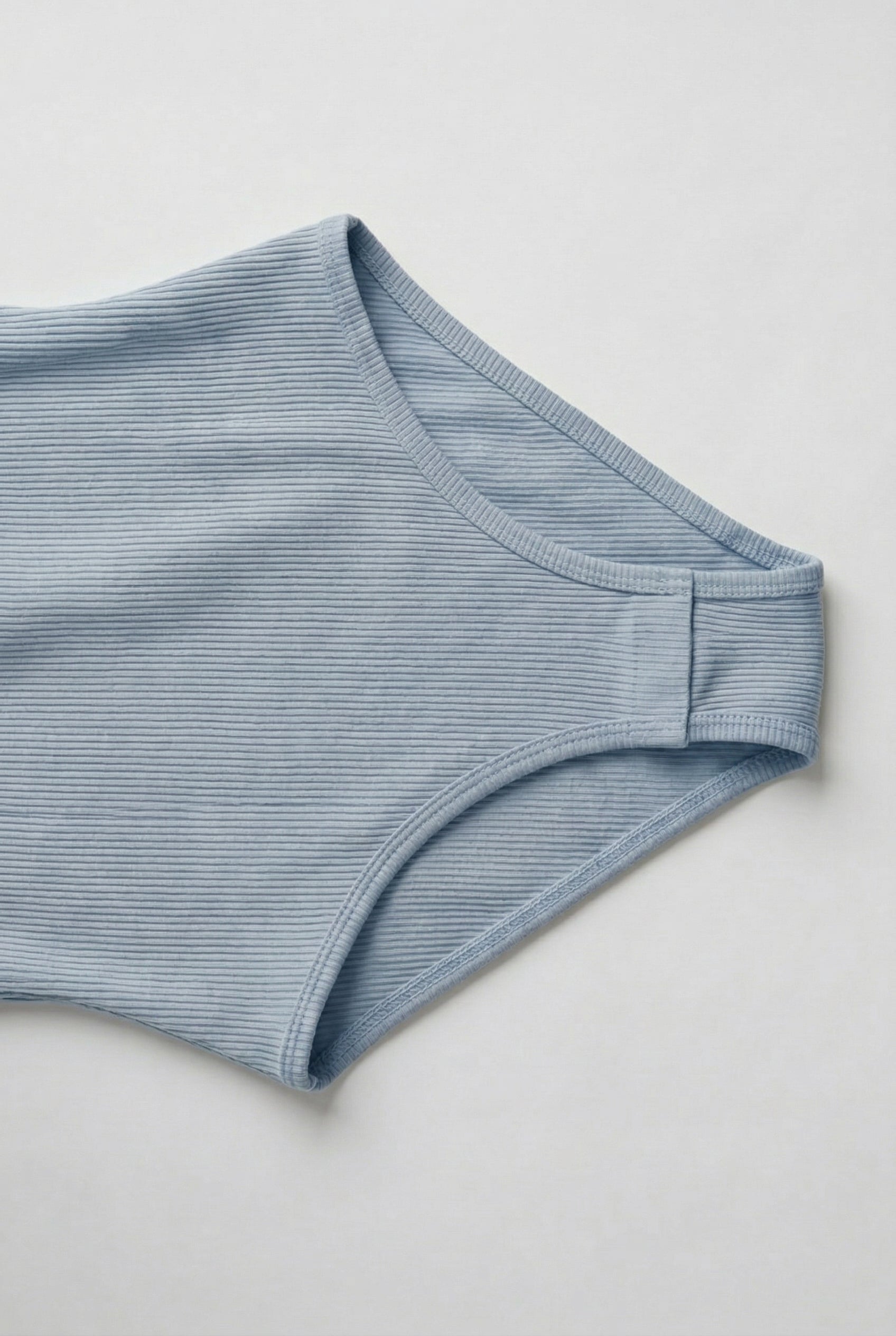 Model wearing an Echo Blue light blue square neck one-piece swimsuit