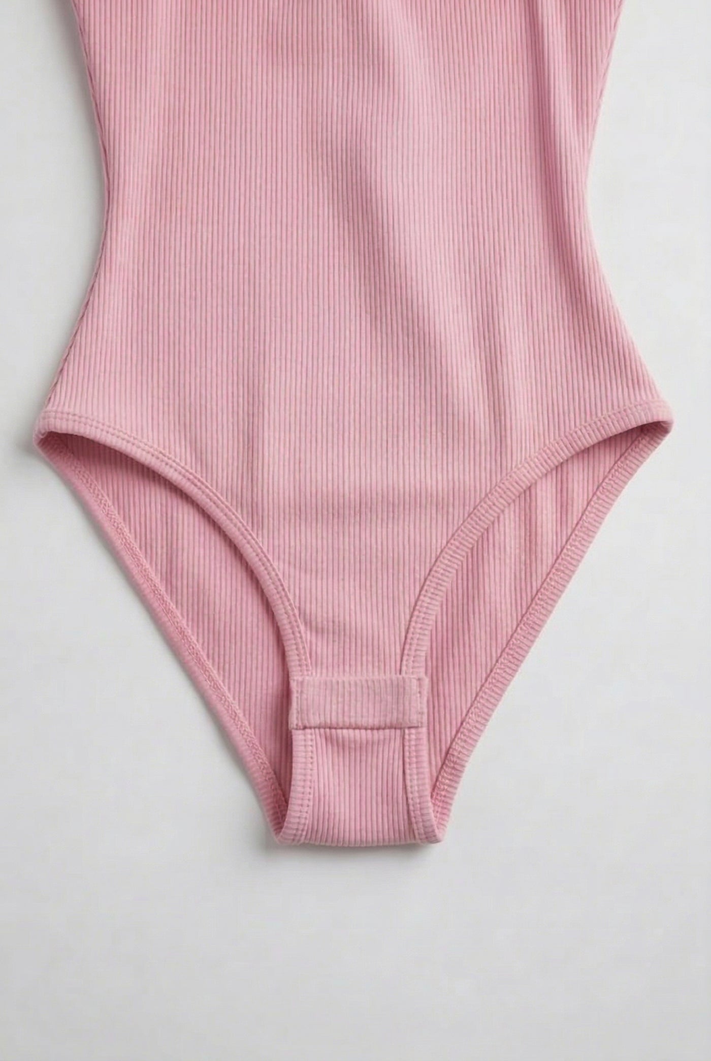 Model wearing a Fairy Pink light pink square neck one-piece swimsuit