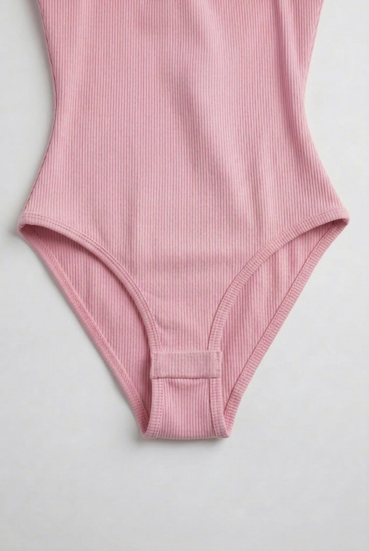 Model wearing a Fairy Pink light pink square neck one-piece swimsuit