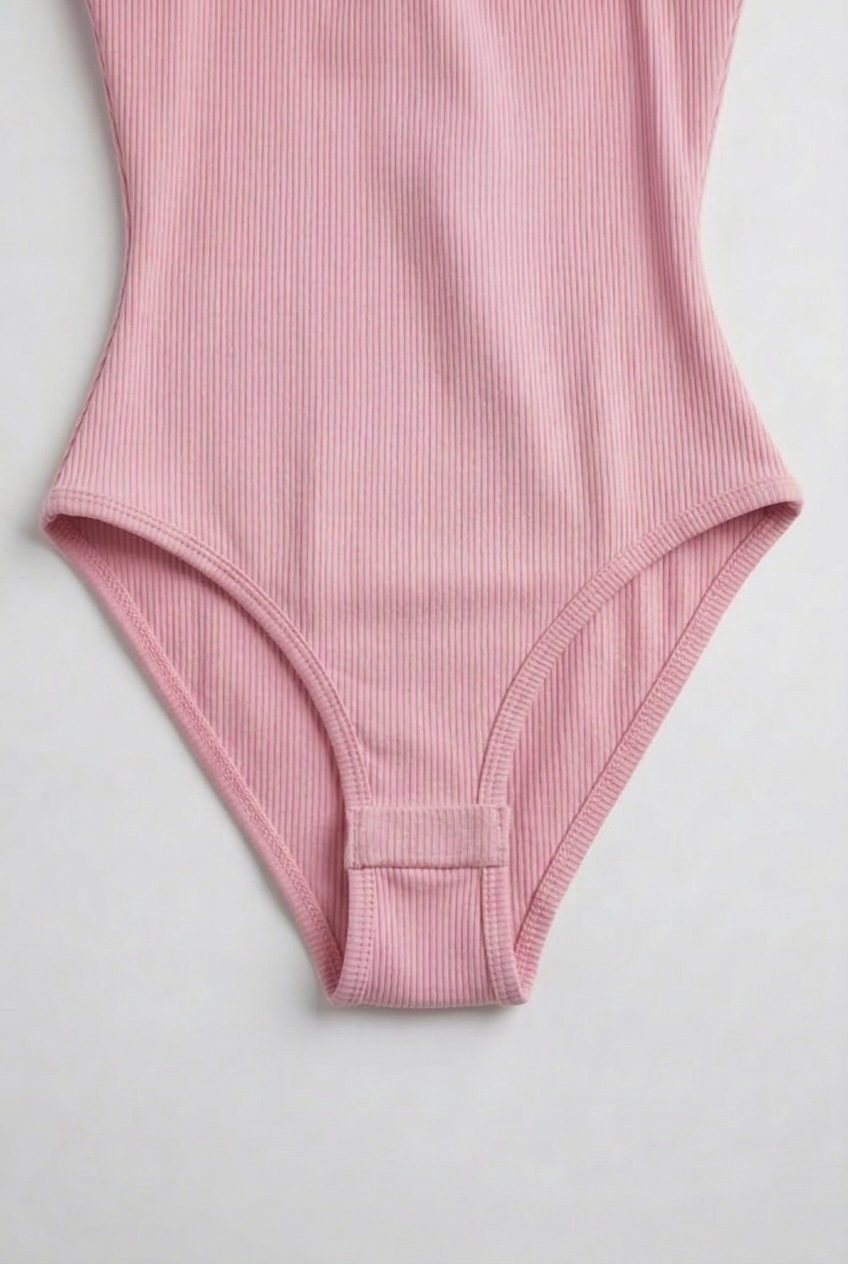 Model wearing a Fairy Pink light pink square neck one-piece swimsuit