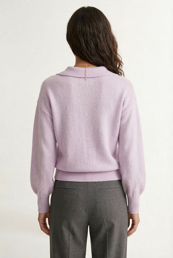 Woman wearing the LOHNR Amélie Collared Sweater in soft lavandin, featuring a relaxed V-neck and structured polo collar.