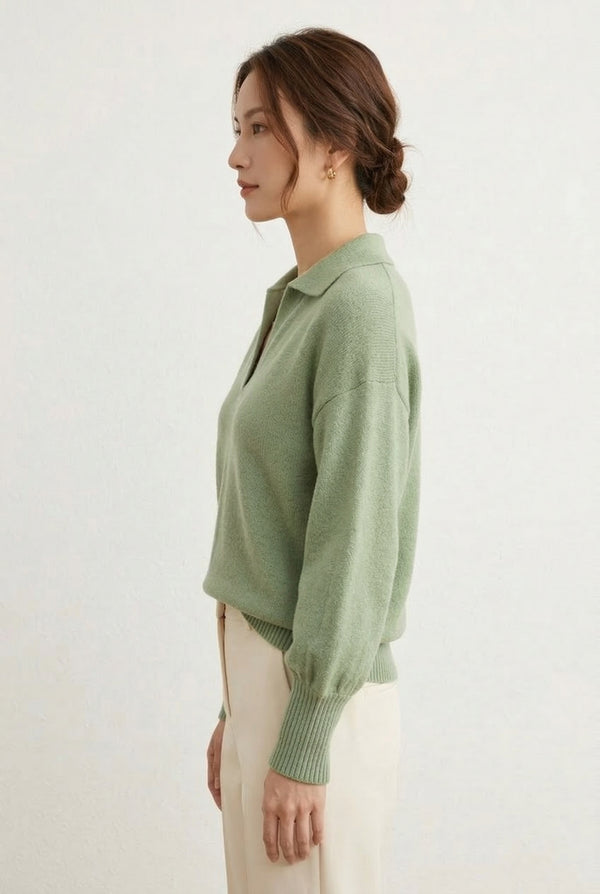 Woman wearing the LOHNR Amélie Collared Sweater in whisper mint, featuring a relaxed V-neck and structured polo collar.
