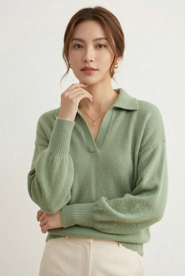 Woman wearing the LOHNR Amélie Collared Sweater in whisper mint, featuring a relaxed V-neck and structured polo collar.