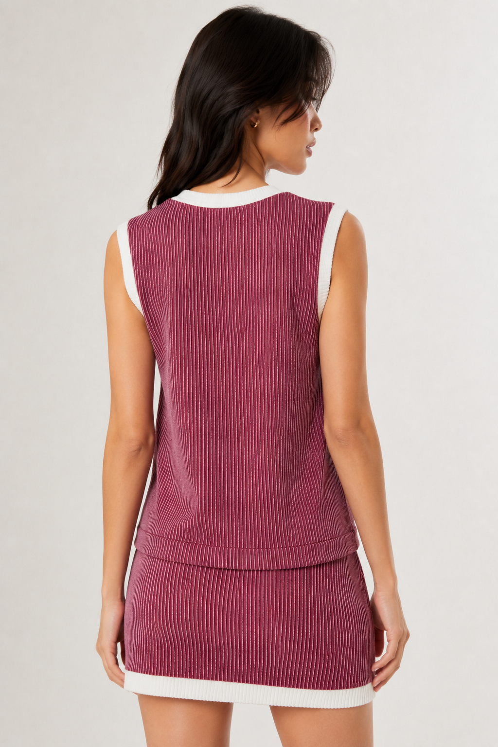 LOHNR Bound Rib Set in Maroon. A structured soft pink sleeveless knit top and matching asymmetric skirt, finished with precision contrast white binding.