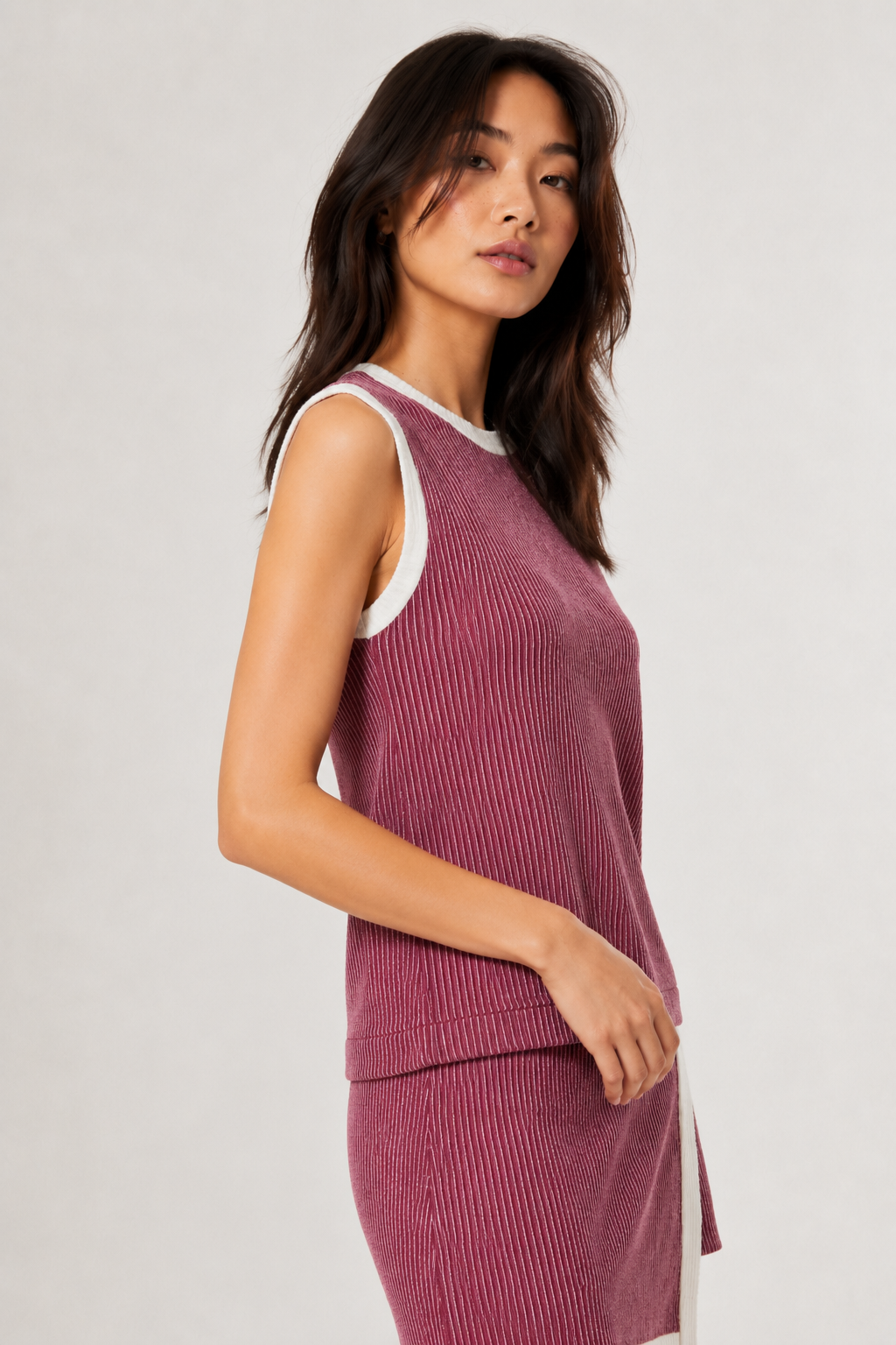 LOHNR Bound Rib Set in Maroon. A structured soft pink sleeveless knit top and matching asymmetric skirt, finished with precision contrast white binding.