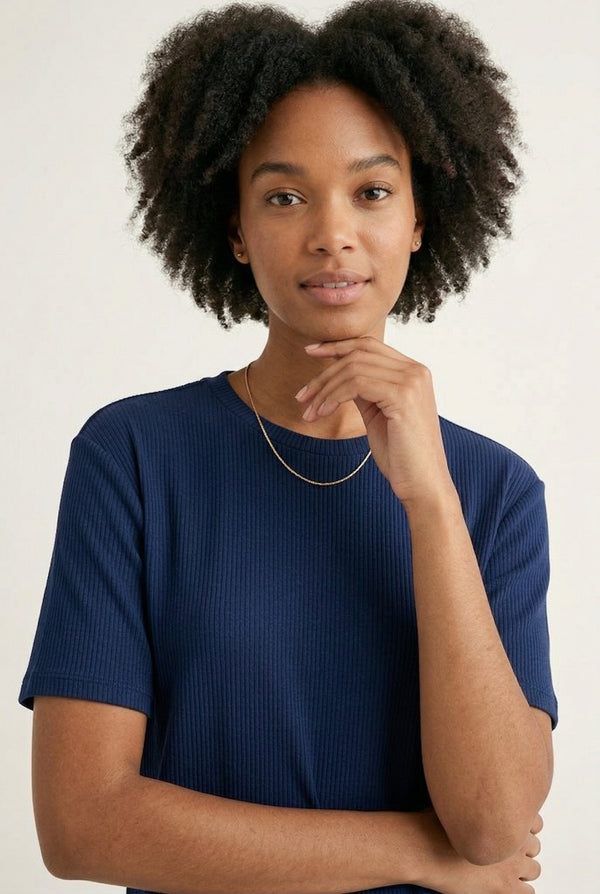 Woman modeling the LOHNR Celine Rib Set in Midnight, an elevated ribbed t-shirt and short loungewear set