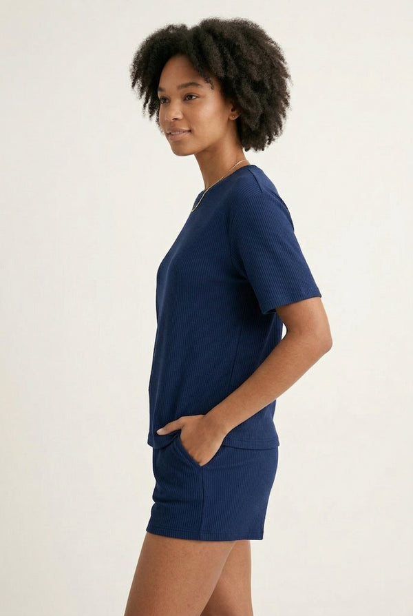 Woman modeling the LOHNR Celine Rib Set in Midnight, an elevated ribbed t-shirt and short loungewear set