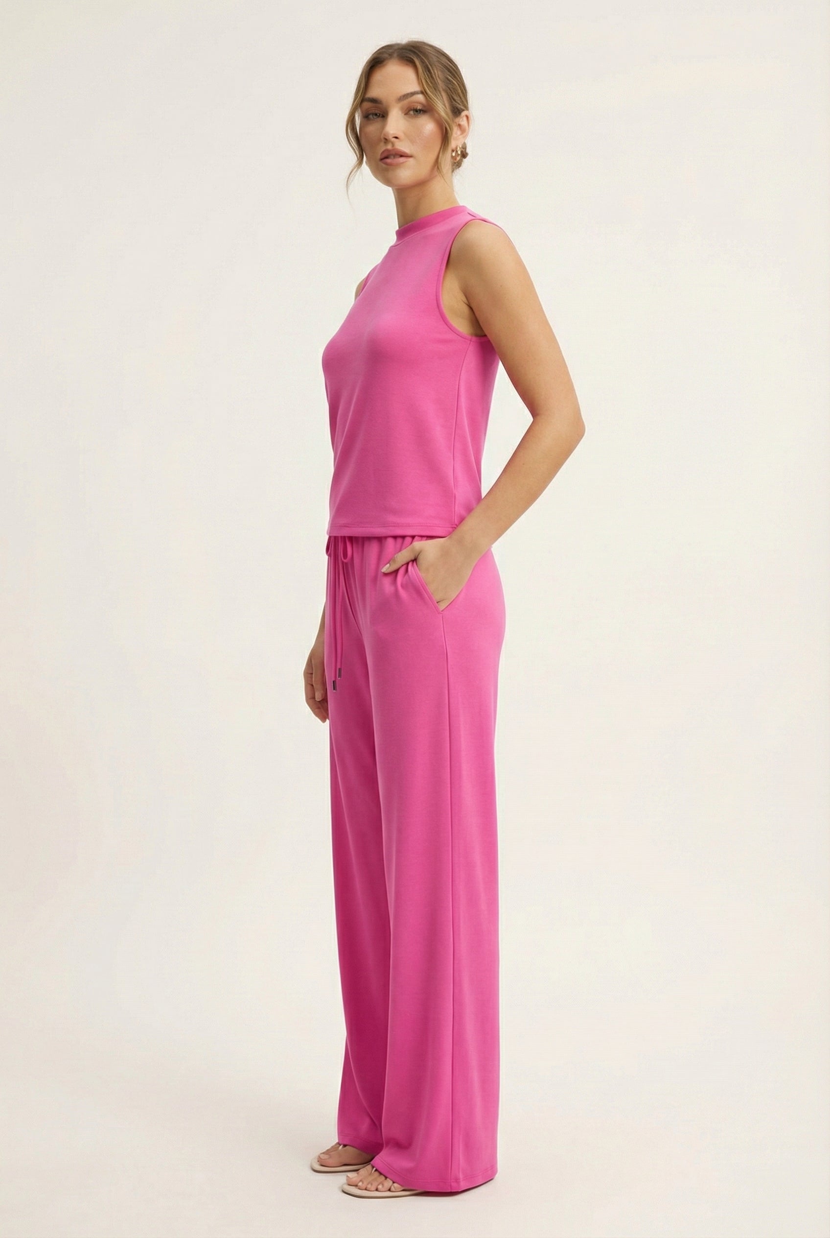 LOHNR Elevé Set in Azalea. A premium sleeveless faux-collar top and wide-leg pant matching set made from a smooth, wrinkle-resistant fabric.