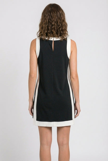 Model wearing the Lohnr Game Day Set in Black, a 100% cotton two-piece outfit featuring hidden shorts with pockets.