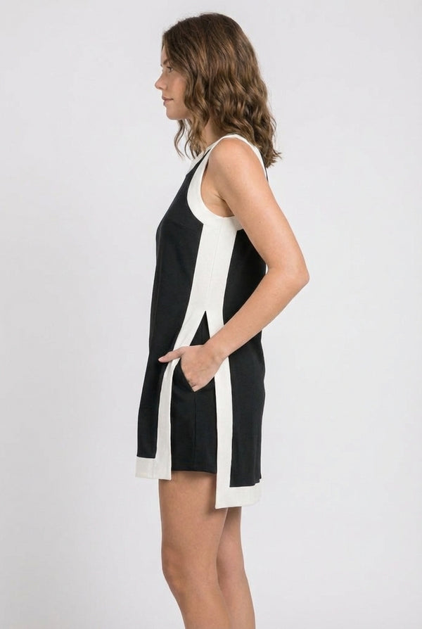 Model wearing the Lohnr Game Day Set in Black, a 100% cotton two-piece outfit featuring hidden shorts with pockets.