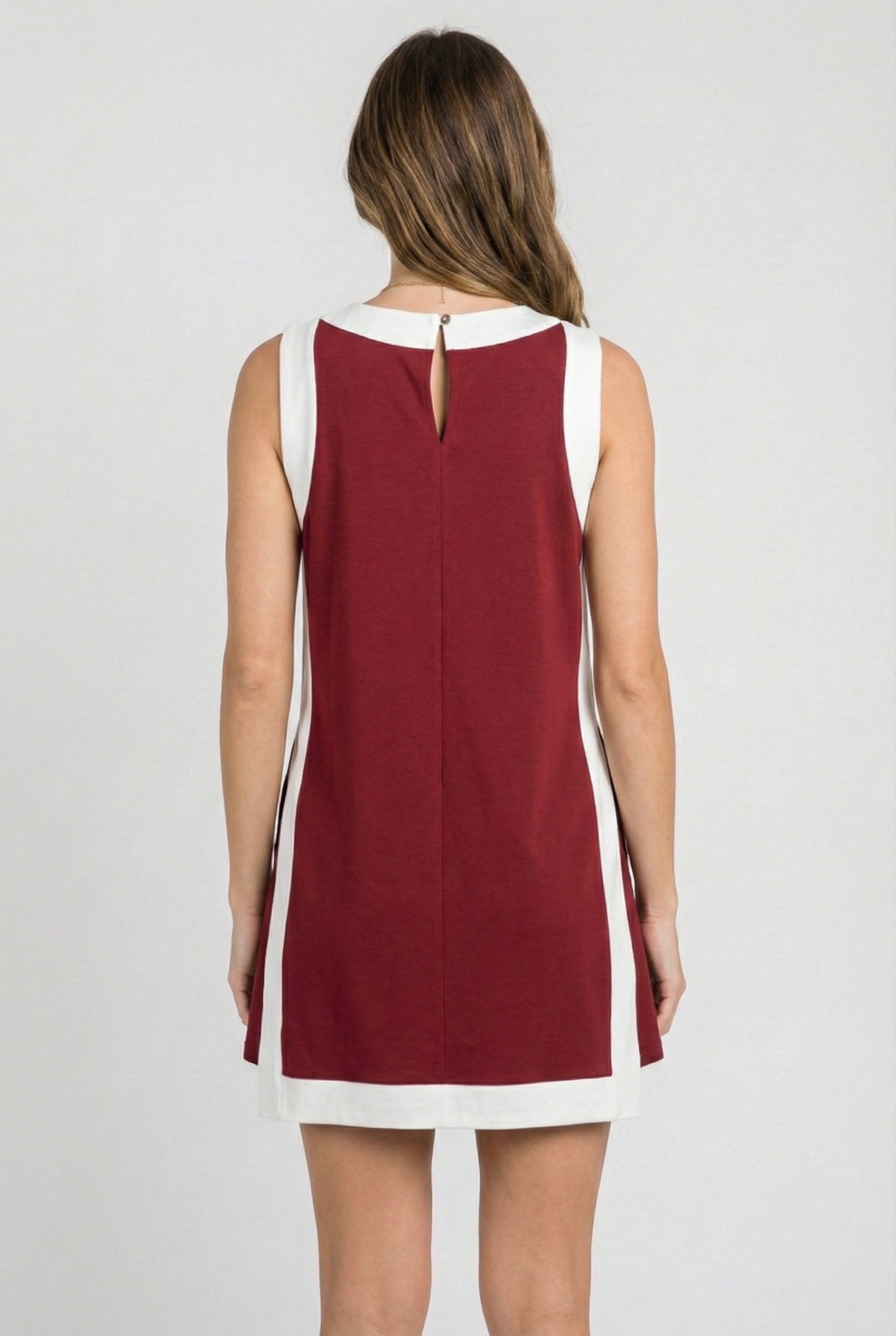 Model wearing the Lohnr Game Day Set in Crimson, a 100% cotton two-piece outfit featuring hidden shorts with pockets.