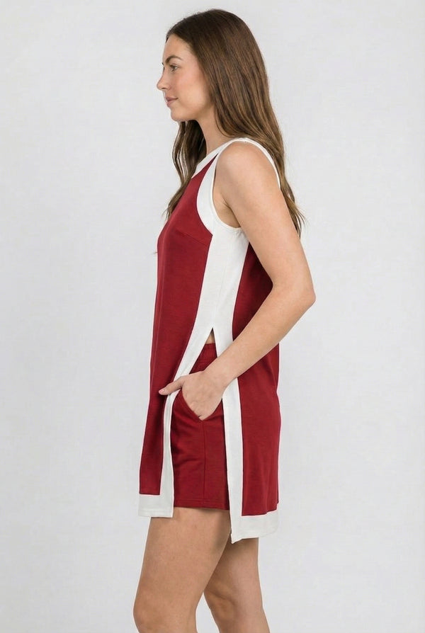 Model wearing the Lohnr Game Day Set in Crimson, a 100% cotton two-piece outfit featuring hidden shorts with pockets.