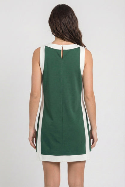 Model wearing the Lohnr Game Day Set in Green, a 100% cotton two-piece outfit featuring hidden shorts with pockets.