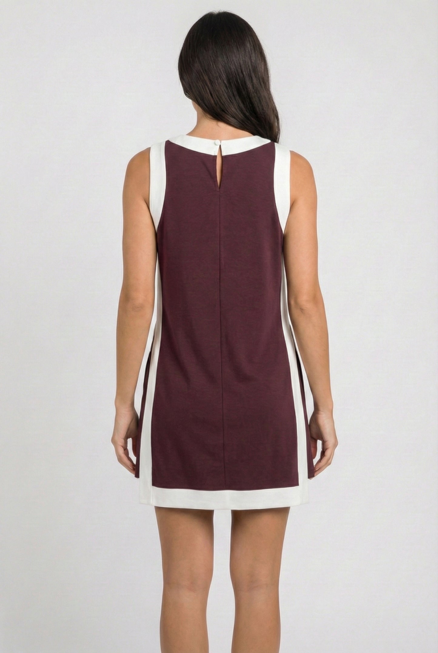 Model wearing the Lohnr Game Day Set in Maroon, a 100% cotton two-piece outfit featuring hidden shorts with pockets.