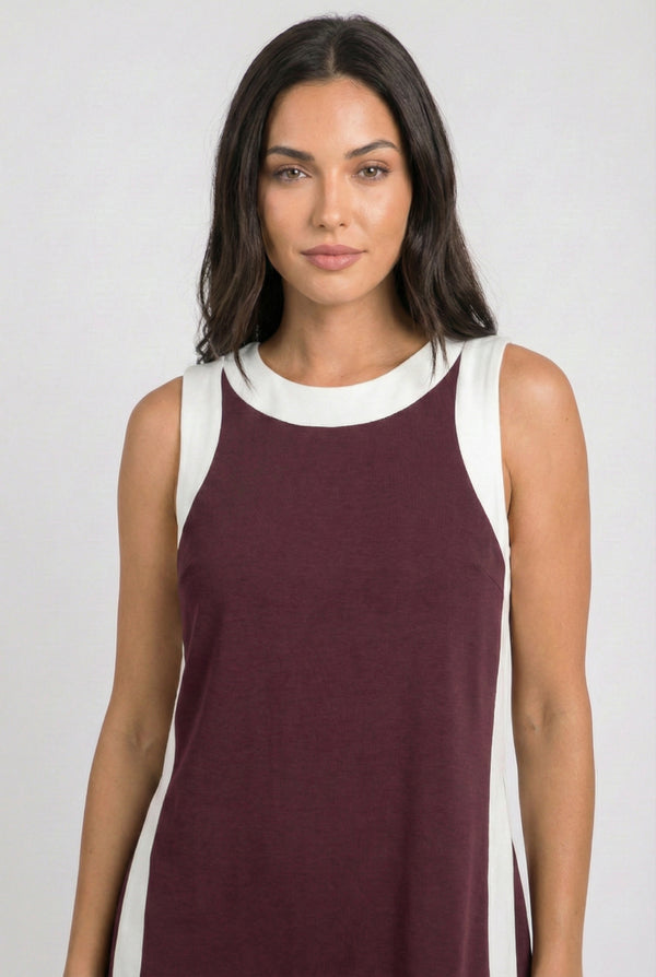 Model wearing the Lohnr Game Day Set in Maroon, a 100% cotton two-piece outfit featuring hidden shorts with pockets.