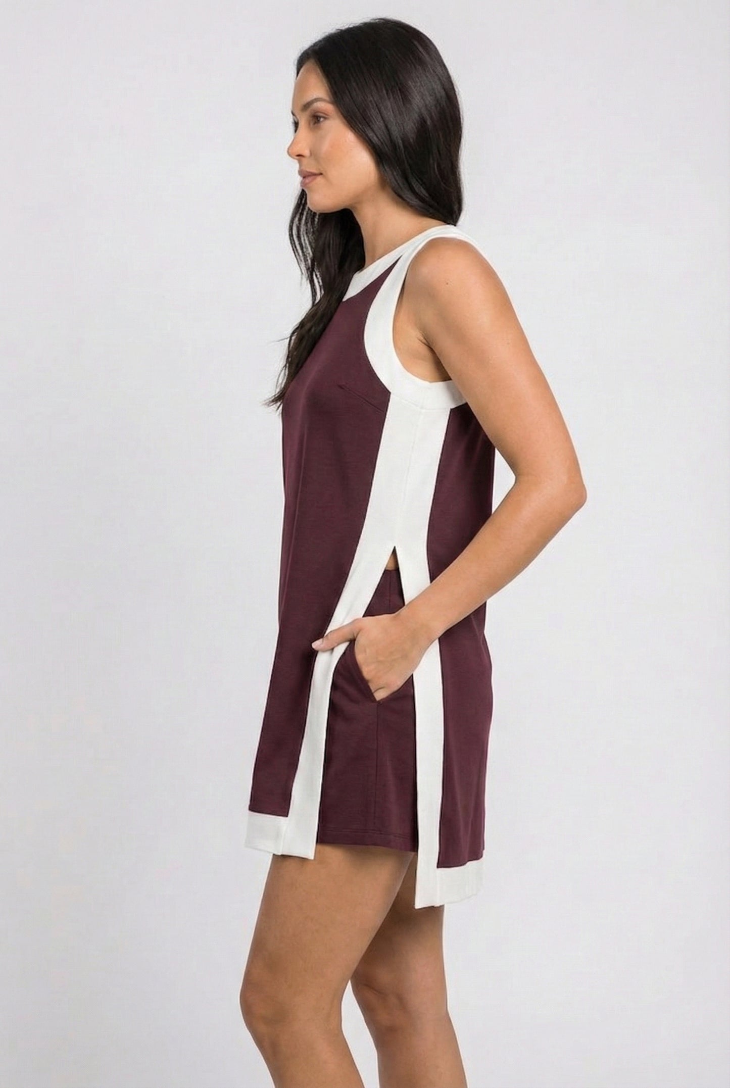 Model wearing the Lohnr Game Day Set in Maroon, a 100% cotton two-piece outfit featuring hidden shorts with pockets.