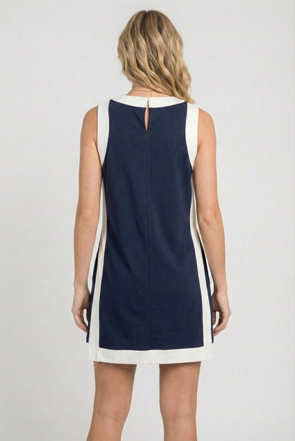 Model wearing the Lohnr Game Day Set in Navy, a 100% cotton two-piece outfit featuring hidden shorts with pockets.