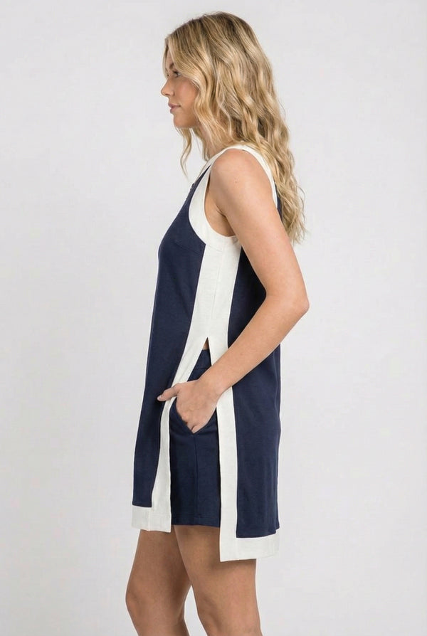 Model wearing the Lohnr Game Day Set in Navy, a 100% cotton two-piece outfit featuring hidden shorts with pockets.