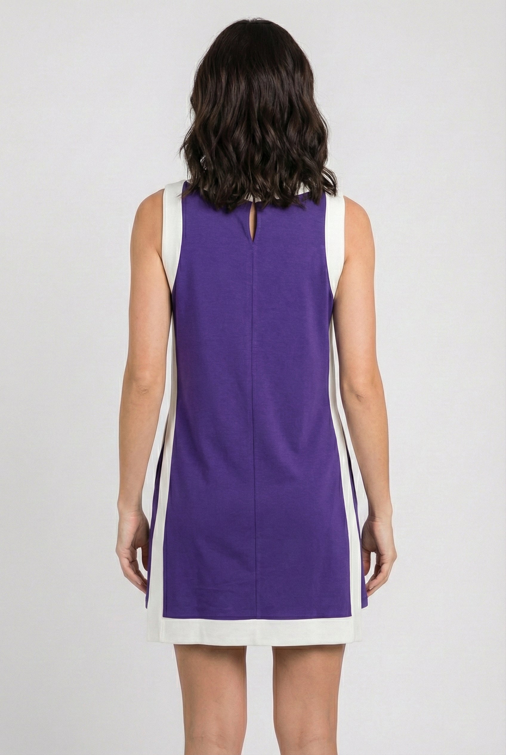 Model wearing the Lohnr Game Day Set in Purple, a 100% cotton two-piece outfit featuring hidden shorts with pockets.