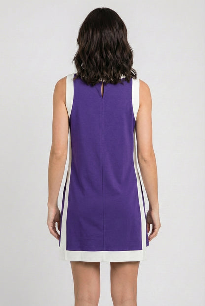 Model wearing the Lohnr Game Day Set in Purple, a 100% cotton two-piece outfit featuring hidden shorts with pockets.