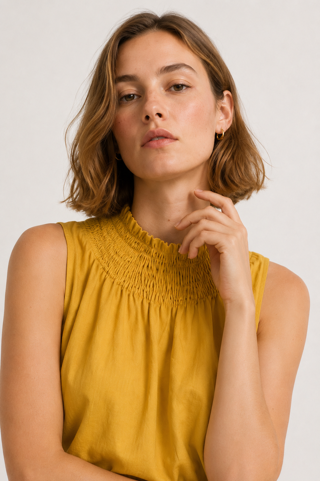 Lohnr Game Day Set in Saffron featuring a minimal sleeveless top and relaxed wide-leg trousers