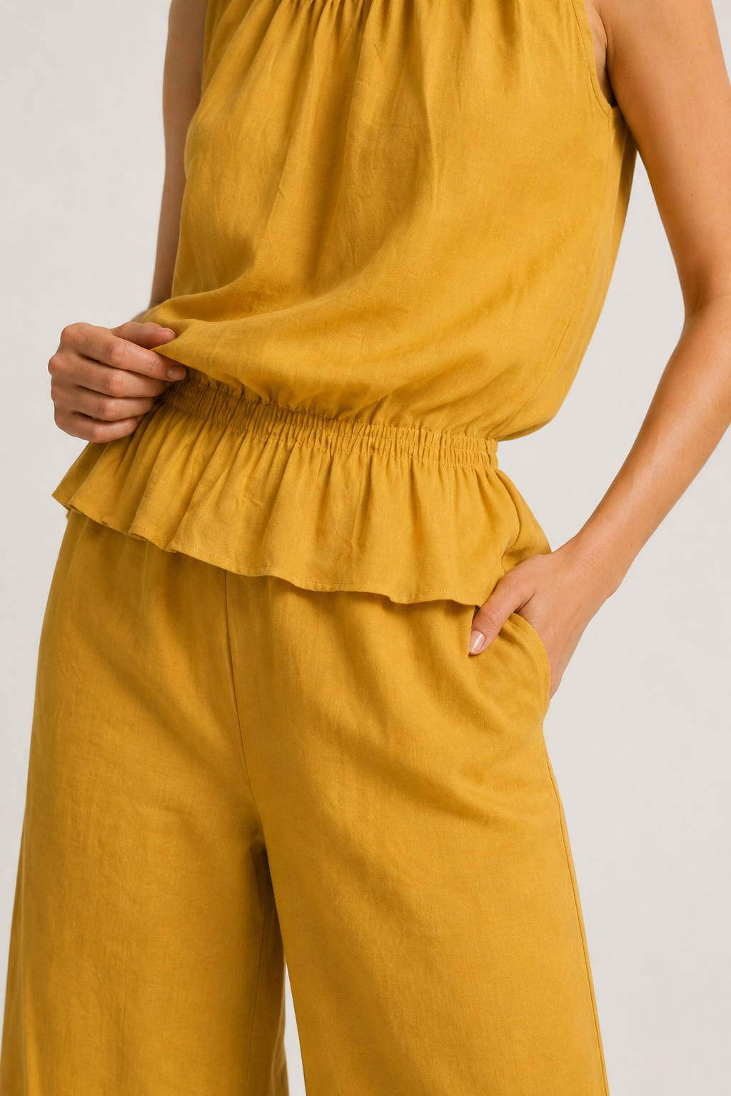 Lohnr Game Day Set in Saffron featuring a minimal sleeveless top and relaxed wide-leg trousers