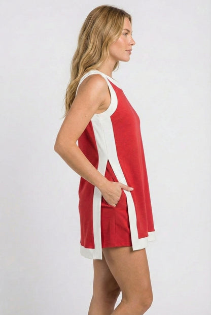 Model wearing the Lohnr Game Day Set in Scarlet, a 100% cotton two-piece outfit featuring hidden shorts with pockets.