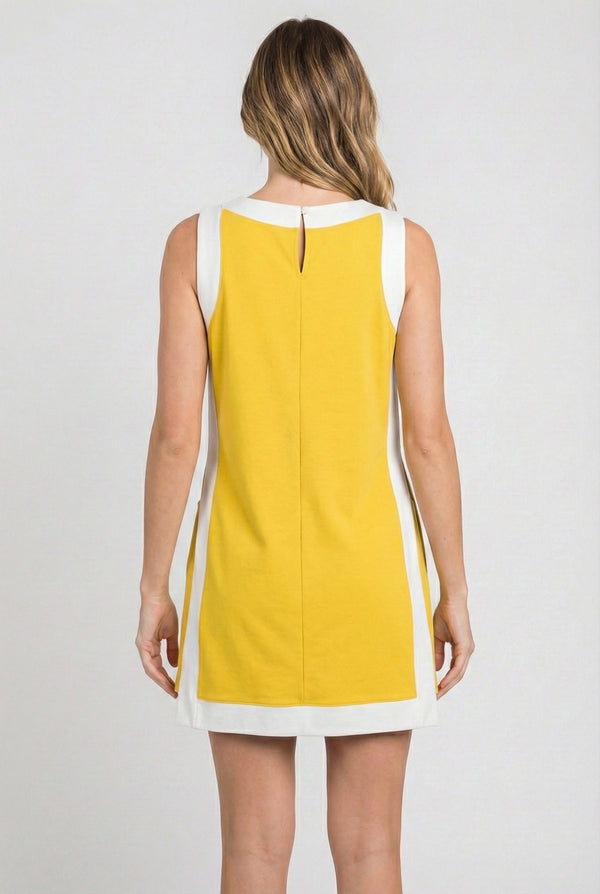 Model wearing the Lohnr Game Day Set in Yellow, a 100% cotton two-piece outfit featuring hidden shorts with pockets.