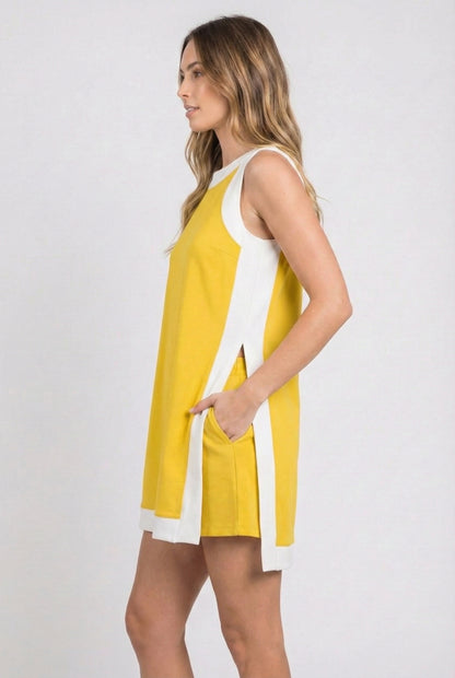 Model wearing the Lohnr Game Day Set in Yellow, a 100% cotton two-piece outfit featuring hidden shorts with pockets.
