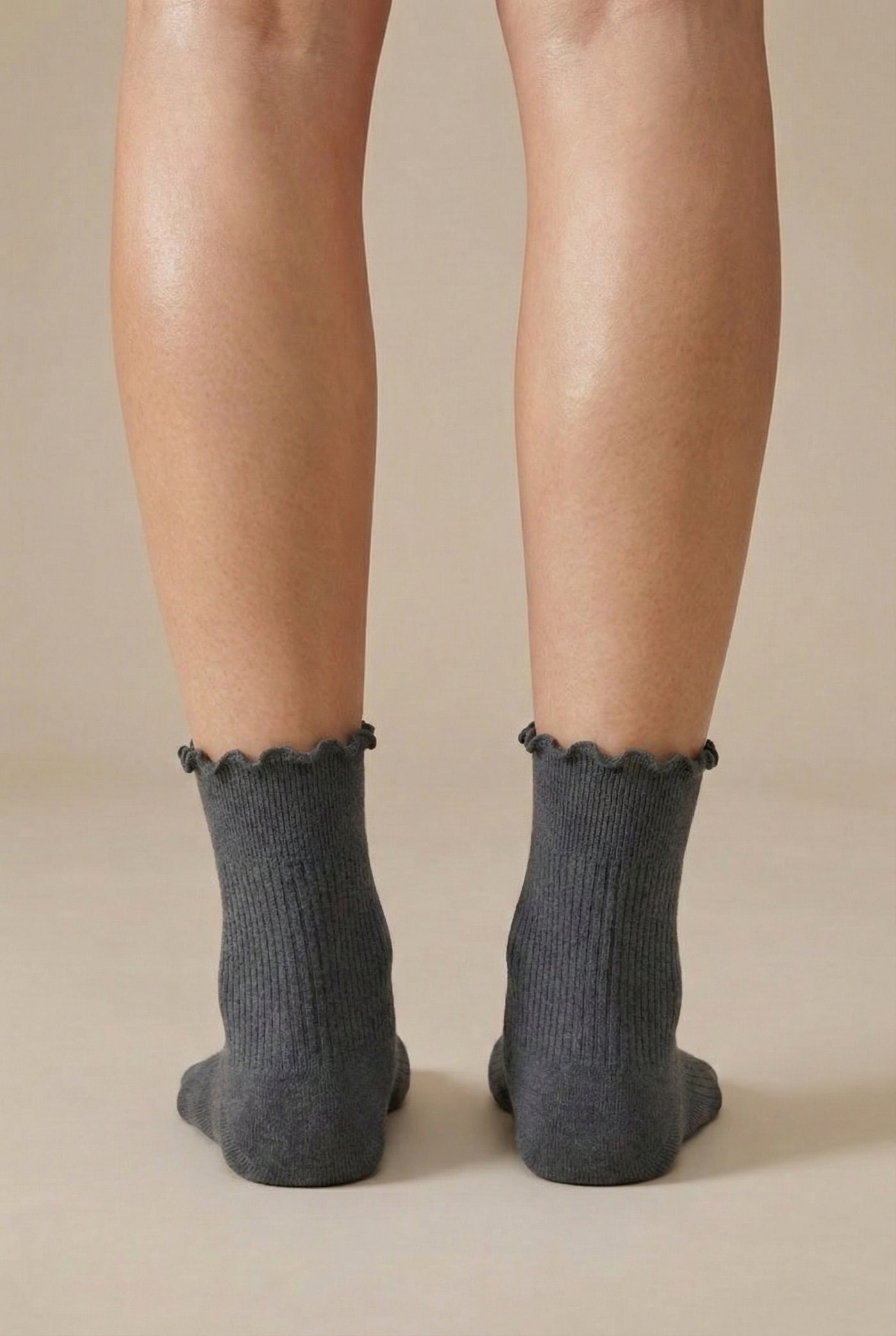 LOHNR Lacey Sock in Ash - A light grey ribbed crew sock designed for lasting comfort, featuring a delicate ruffle trim and a breathable cotton-blend fabric.
