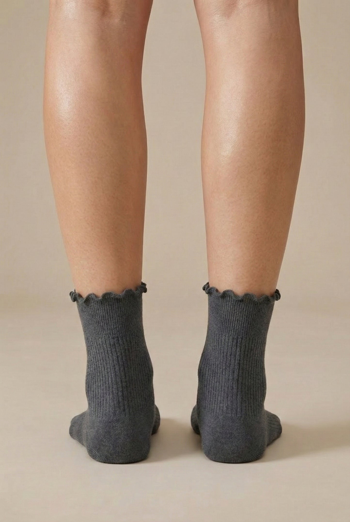 LOHNR Lacey Sock in Ash - A light grey ribbed crew sock designed for lasting comfort, featuring a delicate ruffle trim and a breathable cotton-blend fabric.
