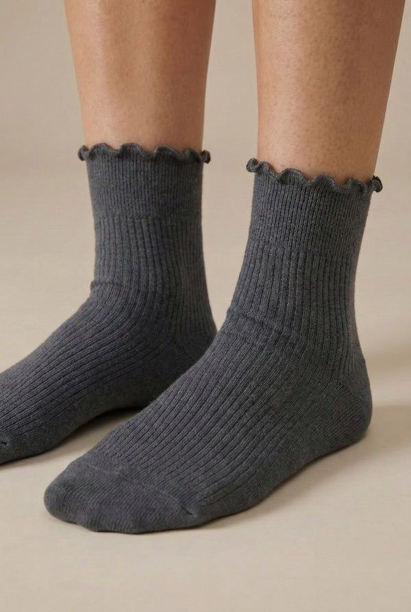 LOHNR Lacey Sock in Ash - A light grey ribbed crew sock designed for lasting comfort, featuring a delicate ruffle trim and a breathable cotton-blend fabric.