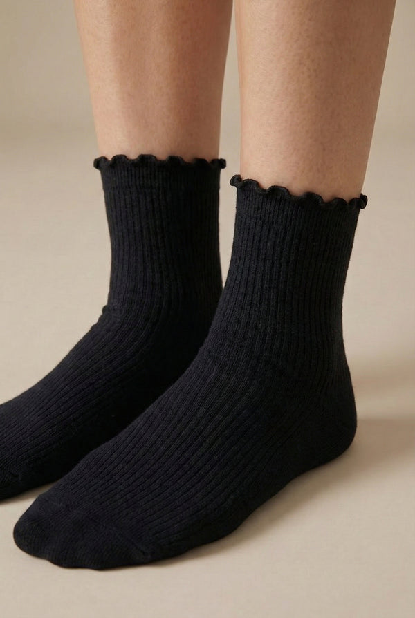 LOHNR Lacey Sock in Charcoal - A dark grey ruffle-edge crew sock that balances functional stretch with an elegant, textured ribbed design for elevated loungewear styling.