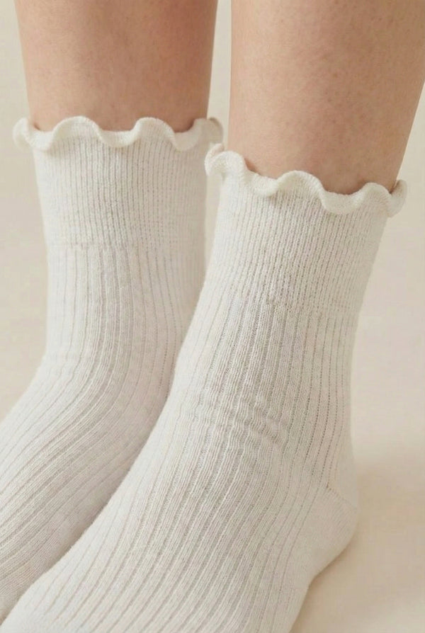 LOHNR Lacey Sock in Crema - An effortless off-white ruffle-edge crew sock offering quiet luxury with its sculpted rib texture and flexible, all-day stretch.
