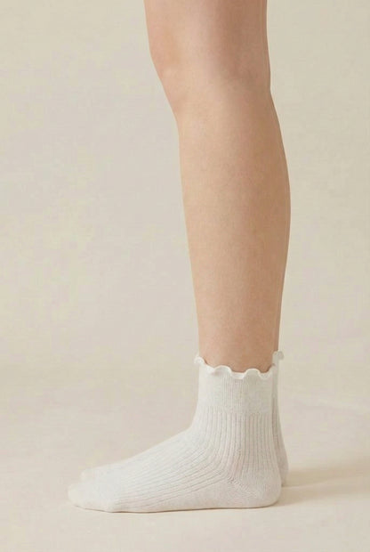 LOHNR Lacey Sock in Crema - An effortless off-white ruffle-edge crew sock offering quiet luxury with its sculpted rib texture and flexible, all-day stretch.