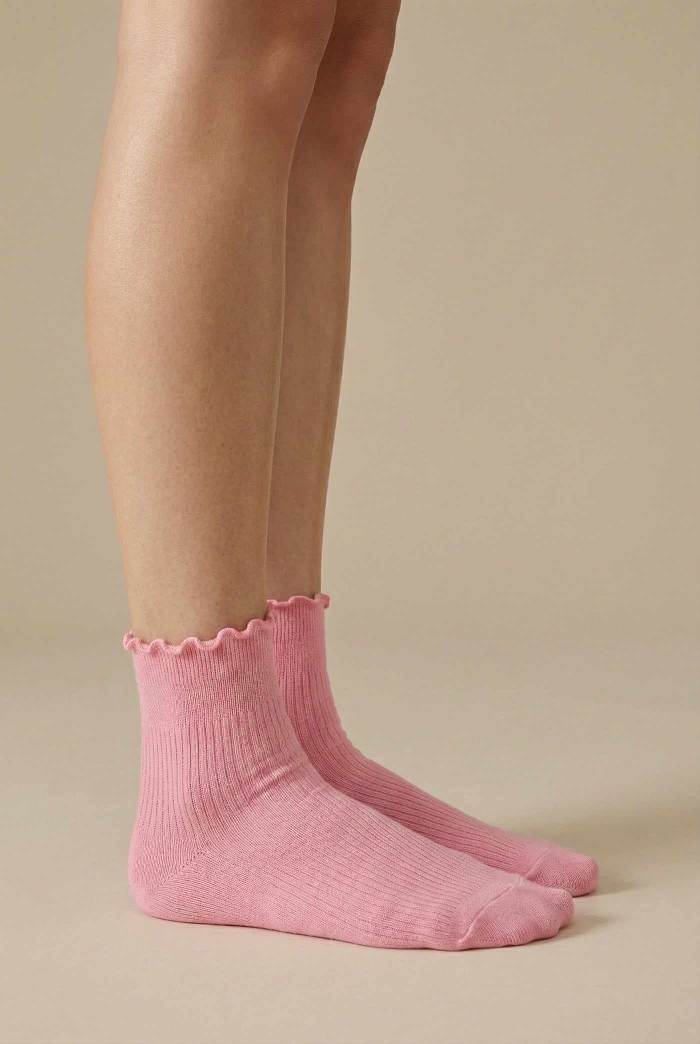 LOHNR Lacey Sock in Petal - A deep rose pink stretch crew sock crafted from a breathable cotton blend, finished with a feminine ruffle-edge and secure stay-up fit.
