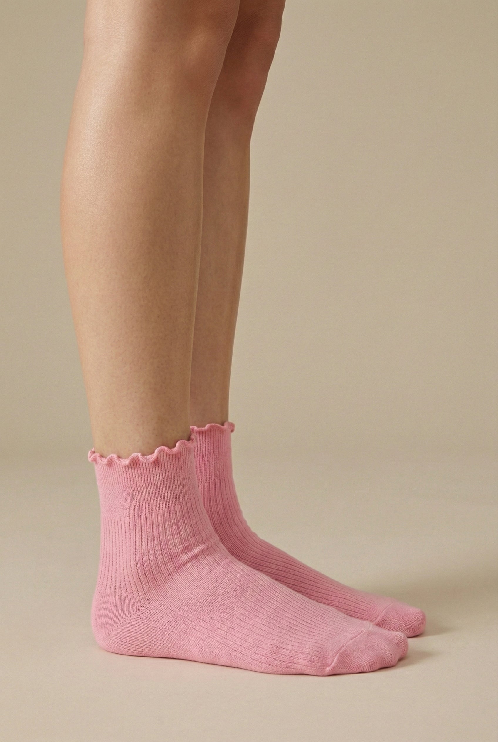 LOHNR Lacey Sock in Petal - A deep rose pink stretch crew sock crafted from a breathable cotton blend, finished with a feminine ruffle-edge and secure stay-up fit.