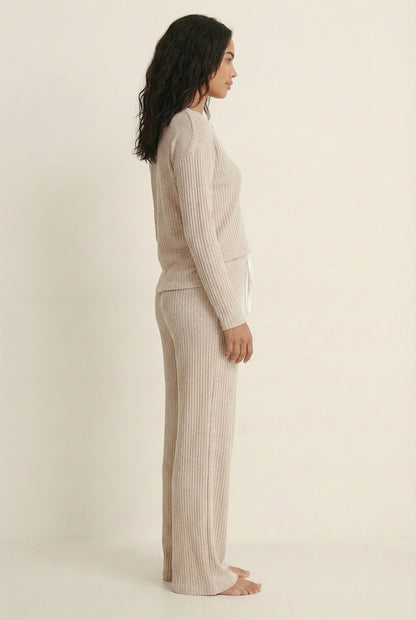 Women's Linea Set by LOHNR in Soft Apricot. A premium matching lounge set featuring a smooth, sweatshirt-material henley top and tailored comfortable joggers.