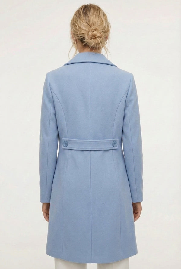 Coast light blue Mercer Coat by LOHNR, a tailored faux wool trench coat featuring structured lapels, deep utility pockets, and a refined quiet luxury aesthetic.
