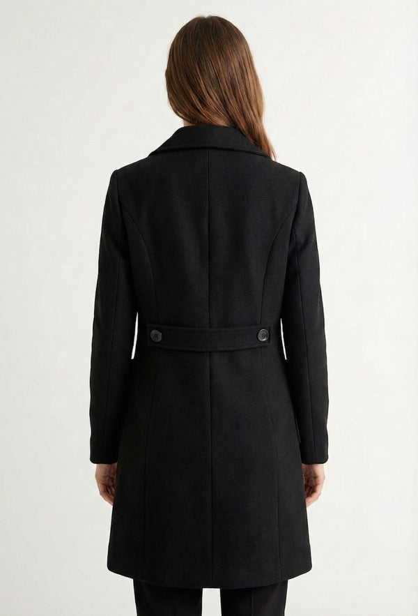 Onyx black Mercer Coat by LOHNR, a tailored faux wool trench coat featuring structured lapels, deep utility pockets, and a refined quiet luxury aesthetic.